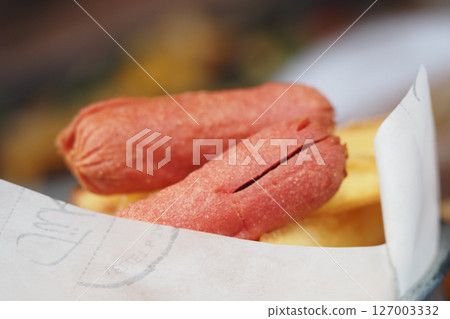 Hot dogs served with crispy french fries at a food stall 127003332