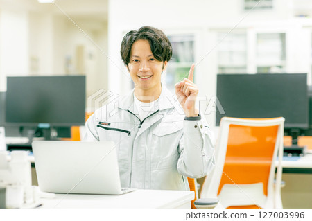 Engineer operating a computer 127003996