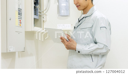 Electrician checking man 127004012