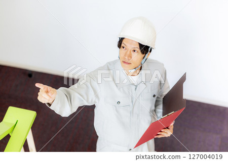 Construction worker climbing stairs Construction worker climbing stairs 127004019