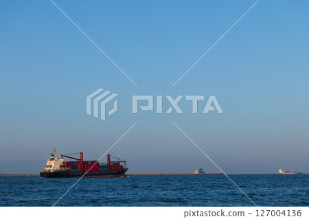 Container ship leaving the port 127004136