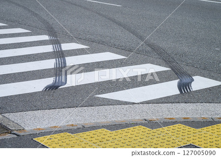 Tire marks of a runaway car on a pedestrian crossing Tire marks of a runaway car on a pedestrian crossing 127005090