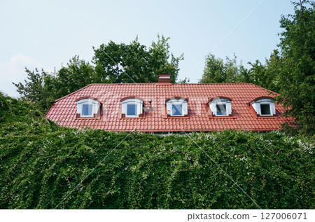 House with a red roof and four windows House with a red roof and four windows 127006071