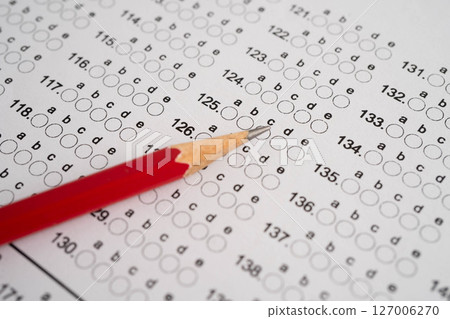 Answer sheets with pencil drawing fill to select choice, education. 127006270