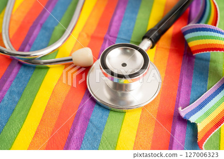 Stethoscope on LGBT rainbow flag, rights and gender equality. Stethoscope on LGBT rainbow flag, rights and gender equality. 127006323