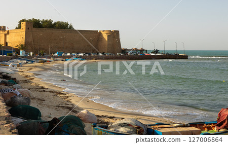 Ancient citadel of Hammamet standing over Mediterranean seashore 127006864