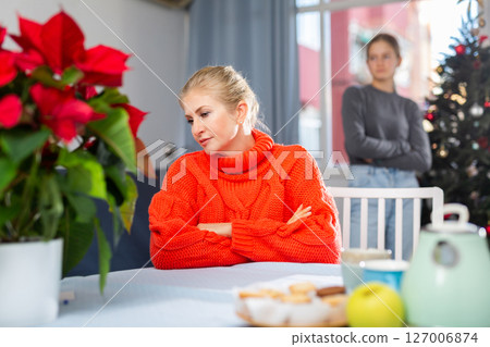 Upset adult woman ignoring her daughter 127006874