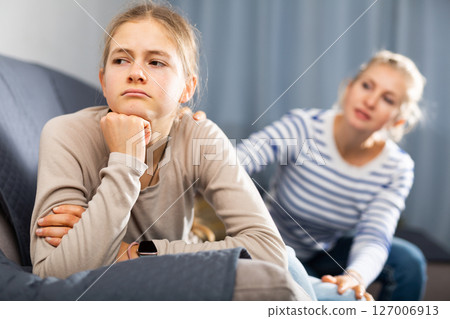 Sad teen girl after discord with her mother Sad teen girl after discord with her mother 127006913
