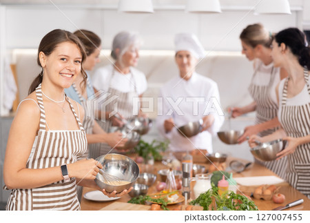 Young woman learns to cook at master class Young woman learns to cook at master class 127007455