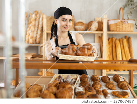 Armenian young woman work selling in family bakery shop Armenian young woman work selling in family bakery shop 127007497