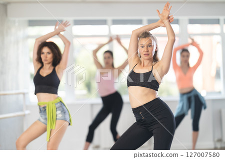 Adult woman dancing high heels in group 127007580