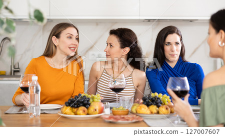 Female friends having fun at intimate house party Female friends having fun at intimate house party 127007607