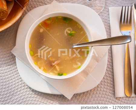 Popular dish of Spanish cuisine is Cocido de garbanzos, made from meat, vegetables and chickpeas, closeup 127008054