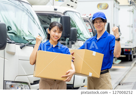 Staff delivering luggage 127008252