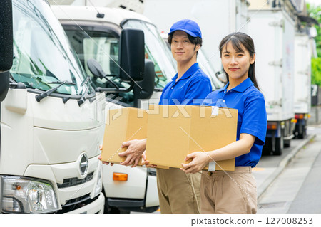 Staff delivering luggage Staff delivering luggage 127008253