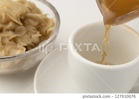 Warm ginger ale made with ginger syrup Warm ginger ale made with ginger syrup 127010076