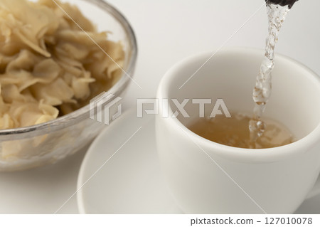 Warm ginger ale made with ginger syrup Warm ginger ale made with ginger syrup 127010078