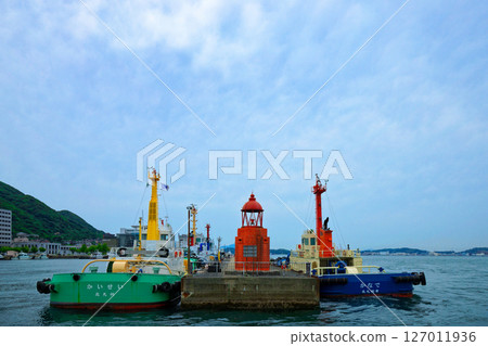 View of the red lighthouse at Mojiko Port from the ferry View of the red lighthouse at Mojiko Port from the ferry 127011936