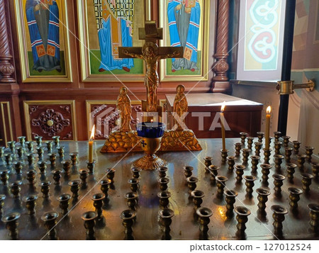 Orthodox Church Candle Stand in Sacred Style in Golds, Blues, and Brass Tones representing Devotion and Prayer with Crucifix and Icons Orthodox Church Candle Stand in Sacred Style in Golds, Blues, and Brass Tones representing Devotion and Prayer with Crucifix and Icons 127012524