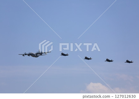 Stealth fighter jets flying in formation, F-35, mid-air refueling 127012630