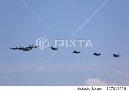 Stealth fighter jets flying in formation, F-35, mid-air refueling 127012636