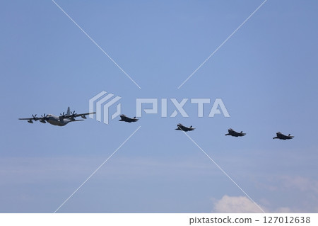 Stealth fighter jets flying in formation, F-35, mid-air refueling 127012638