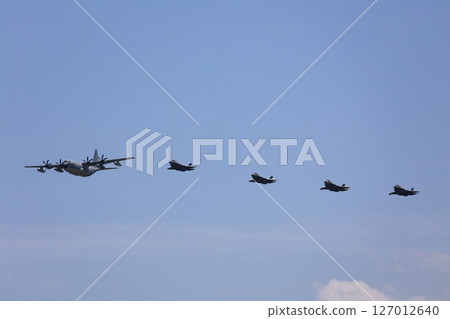 Stealth fighter jets flying in formation, F-35, mid-air refueling 127012640