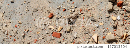 Construction waste close up. Broken bricks, demolition debris, and destruction fragments and rubbish 127013504