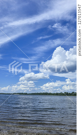 River surrounded by trees. Camping Volumetric clouds. Outdoor recreation. 127013547