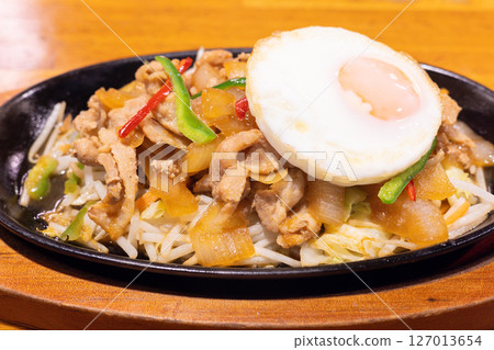 Delicious fried egg topped with pork and ginger 127013654