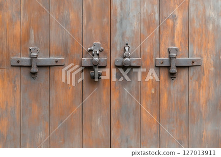 old rusty door with wrought iron rivets old rusty door with wrought iron rivets 127013911