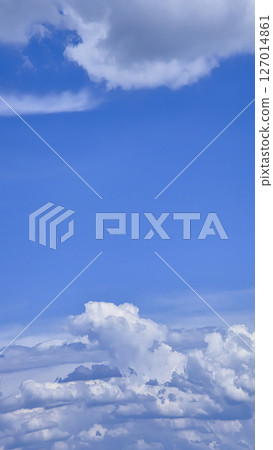 Blue sky with voluminous fluffy clouds. Thunderstorm over the river. Blue sky with voluminous fluffy clouds. Thunderstorm over the river. 127014861