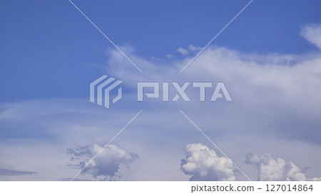 Blue sky with voluminous fluffy clouds. Thunderstorm over the river. Blue sky with voluminous fluffy clouds. Thunderstorm over the river. 127014864