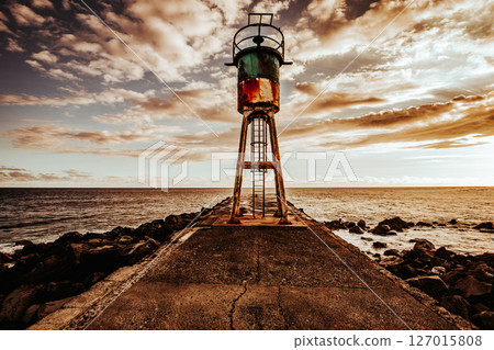 Jetty and lighthouse in Saint-Pierre, La Reunion island Jetty and lighthouse in Saint-Pierre, La Reunion island 127015808