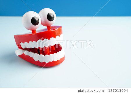 Funny red teeth with eye toy denture model for dental health care. Funny red teeth with eye toy denture model for dental health care. 127015994