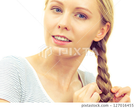 Blonde young woman with braid hair 127016455
