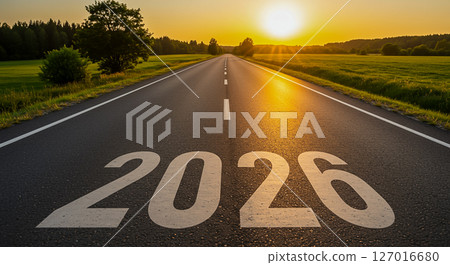 2026 painted on a foggy country road at sunrise. Symbolizes a hopeful new year journey 2026 painted on a foggy country road at sunrise. Symbolizes a hopeful new year journey 127016680