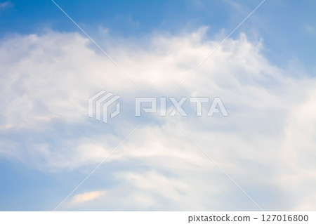 A blue sky with soft clouds. A blue sky with soft clouds. 127016800