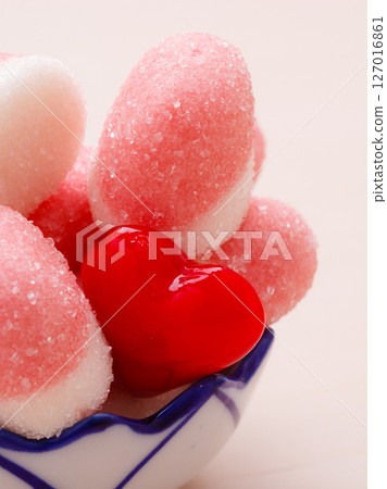 Pink jellies or marshmallows with sugar in bowl 127016861