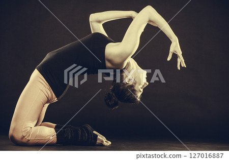 Fit girl stretching warming up. 127016887