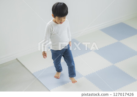 Child running on floor 127017426