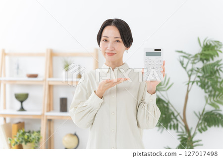Woman with a calculator 127017498