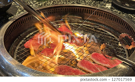 A scene from a yakiniku restaurant (the flames are heated by the fat from the yakiniku) 127017569