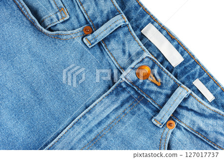 Front side of blue jeans pants. Design details, metal button, waistband, pocket and small pocket Front side of blue jeans pants. Design details, metal button, waistband, pocket and small pocket 127017737