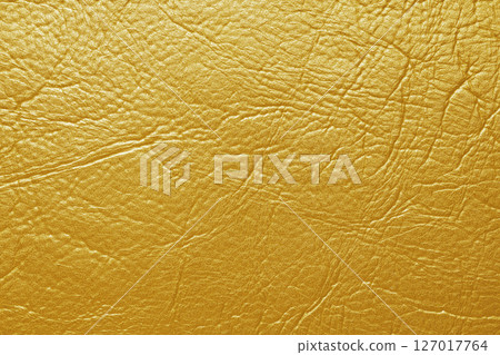 Close up, macro texture of yellow glossy natural genuine leather, leatherette structure Close up, macro texture of yellow glossy natural genuine leather, leatherette structure 127017764