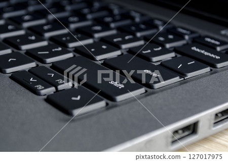 Close up of laptop keyboard and ports demonstrating physical access points for cyber threats. Close up of laptop keyboard and ports demonstrating physical access points for cyber threats. 127017975
