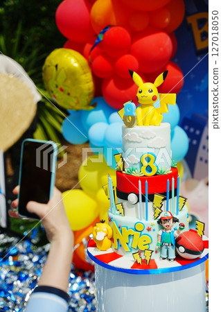 Capturing a Pokemon-Themed Birthday Cake with Smartphone Capturing a Pokemon-Themed Birthday Cake with Smartphone 127018050