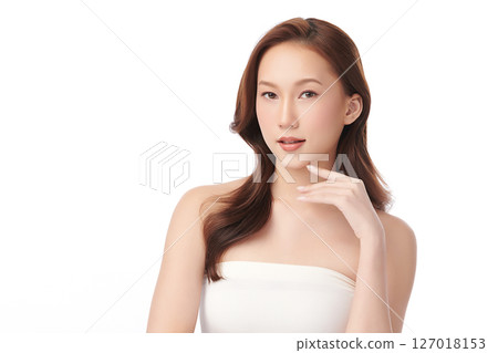 A beautiful young Asian woman with clean, fresh skin against a white background. Skincare, facial treatment, cosmetology, beauty, and spa. An elegant portrait of an Asian woman. A beautiful young Asian woman with clean, fresh skin against a white background. Skincare, facial treatment, cosmetology, beauty, and spa. An elegant portrait of an Asian woman. 127018153