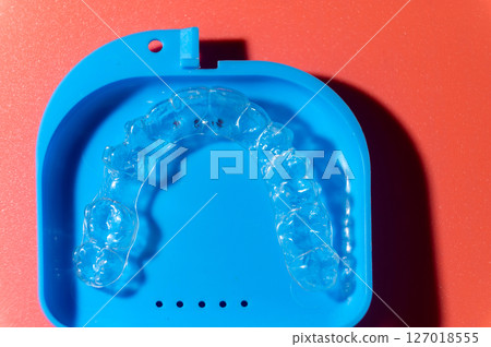 Transparent aligners and storage case. Invisible braces. Clear teeth straighteners. plastic bracers ready to use Transparent aligners and storage case. Invisible braces. Clear teeth straighteners. plastic bracers ready to use 127018555