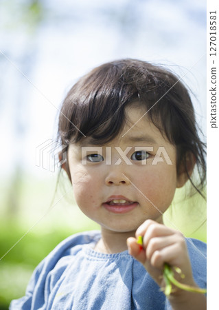 2 year old girl playing in the park 2 year old girl playing in the park 127018581